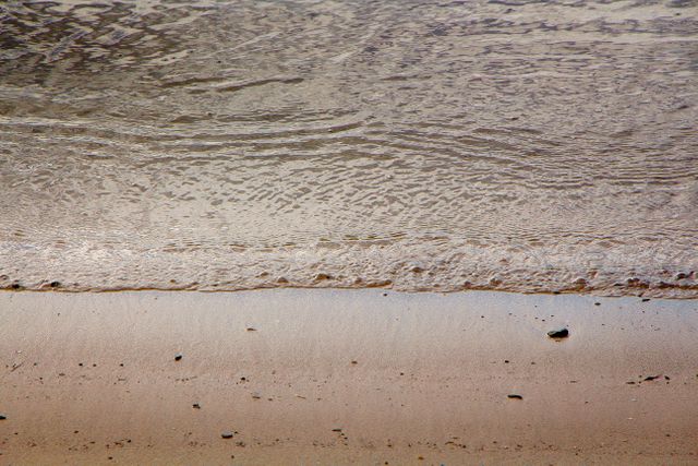 Gentle Waves on Sandy Beach at Shoreline - Download Free Stock Photos Pikwizard.com
