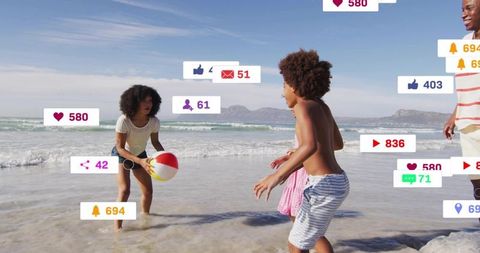 Family playing on sunny beach holding striped beach ball with social media icons overlay