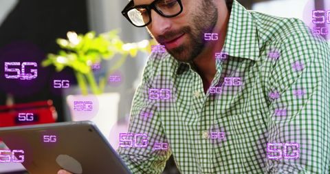 Young Professional Engaging with 5G Technology at Cafe