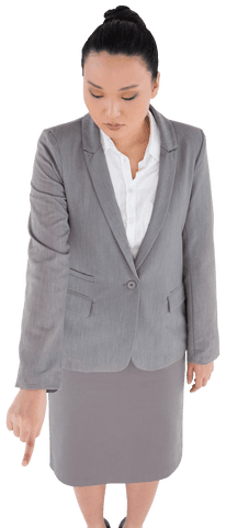 Transparent Image of Businesswoman Pointing Downward Against White Background