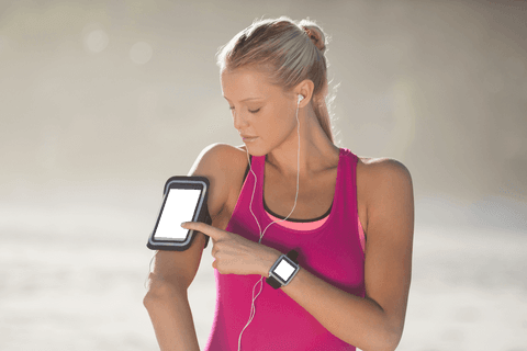 focused woman using fitness tracker and transparent arm band smartphone - Download Free Stock Videos Pikwizard.com