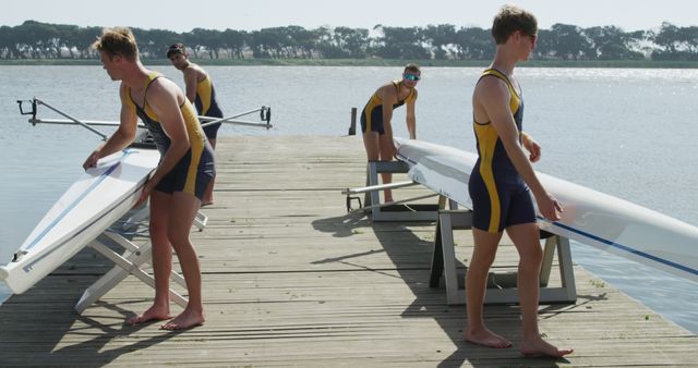 Rowing Team Preparing Boats on Dock for Training Session - Download Free Stock Images Pikwizard.com