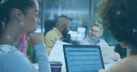 Diverse Professionals in Modern Office Collaborating on Financial Data