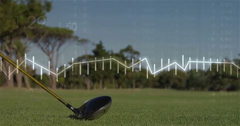 Golf driver with analytics graph outdoors on green fairway