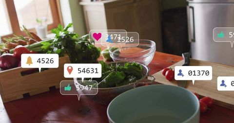 Fresh produce in colander on rustic kitchen table with social media notification overlays and herbs