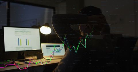 Financial data projection with businessman analyzing charts