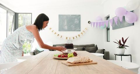 Birthday party table prepped with cake and treats