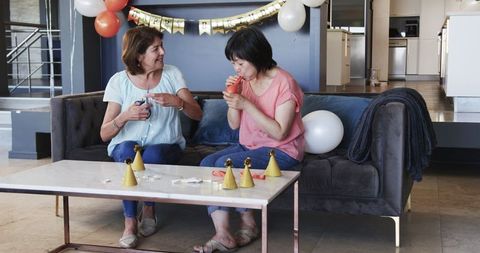 Diverse Friends Prepping Balloons for Birthday Celebration