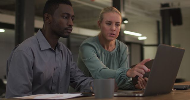 Business Colleagues Analyzing Data on Laptop in Office Setting - Download Free Stock Images Pikwizard.com