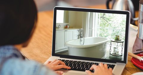 Person Viewing Elegant Bathroom on Laptop Screen - Download Free Stock Images Pikwizard.com