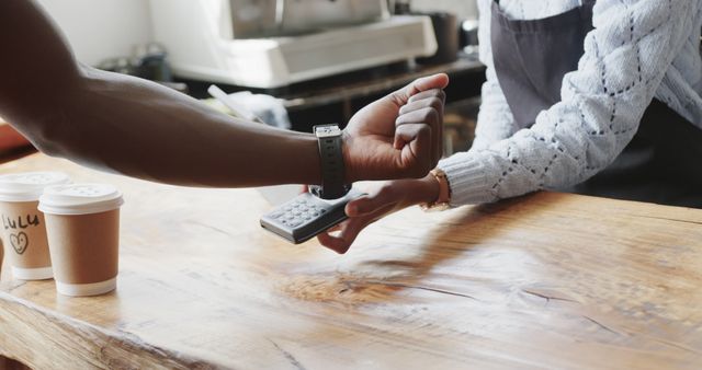 Contactless Payment with Smartwatch in Coffee Shop - Download Free Stock Images Pikwizard.com