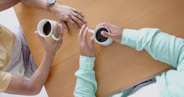 Two People Having a Casual Coffee Meeting with Wooden Table - Download Free Stock Images Pikwizard.com