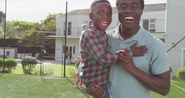 Father and Son Bonding in Backyard on Sunny Day - Download Free Stock Images Pikwizard.com