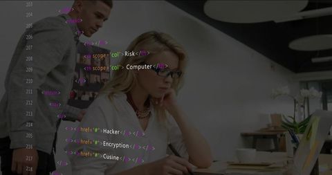 Woman Working on Laptop in Modern Office with Code Overlay