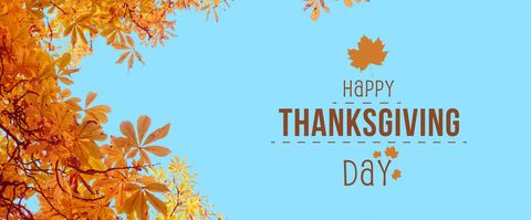 Thanksgiving greeting with autumn leaves and blue sky