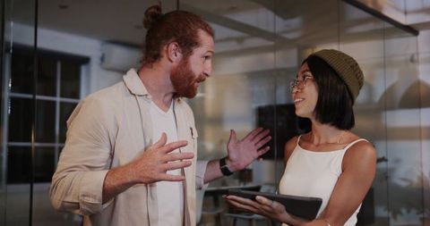 Diverse Colleagues Engaging in Strategic Meeting at Modern Office