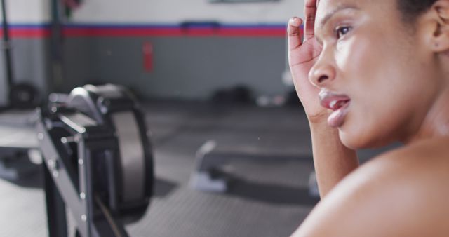 Exhausted Woman Exercising in Gym Wiping Sweat - Download Free Stock Images Pikwizard.com