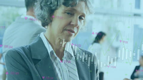 Senior Businesswoman Analyzing Data on Digital Tablet in Office