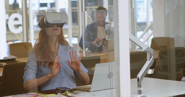 Young Woman Engaged with Virtual Reality Technology in Modern Office - Download Free Stock Images Pikwizard.com