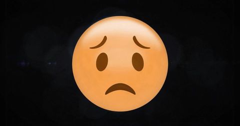 Worried face emoji floating on dark digital background with soft glow and smooth shading