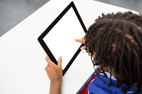 child using tablet with transparent background display on table - Download Free Stock Videos Pikwizard.com