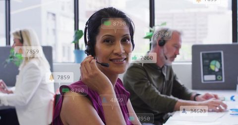 Business People with Headsets Analyzing Digital Data in Modern Office