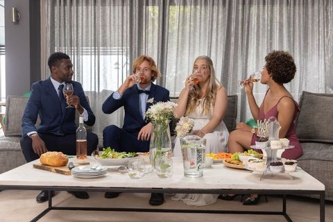 Elegant Wedding Party Toasting with Rosé in Luxurious Lounge