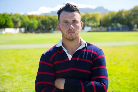 Confident Rugby Player Standing on Sports Field