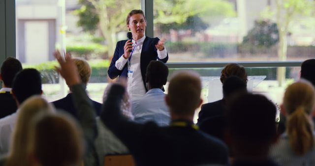 Businessman Giving Presentation to Diverse Audience in Modern Conference Room - Download Free Stock Images Pikwizard.com