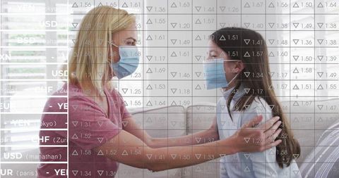 Mother and Daughter at Home with Mask Discussing Protective Measures