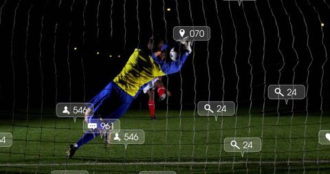 Diving Soccer Goalkeeper on Night Field with Digital Overlay