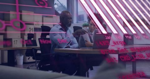 Diverse Business Colleagues Analyzing Financial Data on Computer