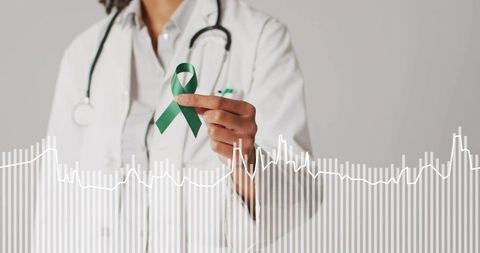 Doctor holding green awareness ribbon with ecg waveform overlay promoting health advocacy