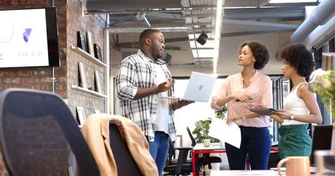 African American Team Collaborating in Modern Office Space