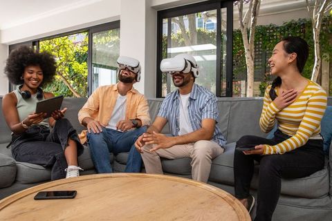 Diverse Friends Enjoying VR Gaming in Modern Living Room