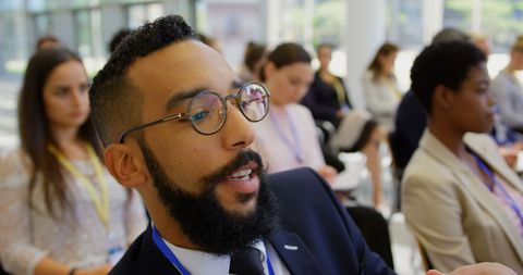 Young professionals engaged at conference seminar