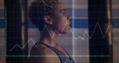 Female Boxer Focused on Performance with Data Overlay