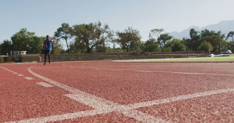 Athlete with Prosthetic Legs Training on Red Track - Download Free Stock Images Pikwizard.com