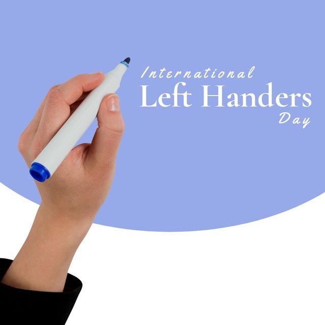 Hand of a Caucasian woman holding a marker, writing 'International Left Handers Day' on a blue backdrop. Ideal for use in content related to left-handed awareness, celebration of left-handed individuals, and promoting events or articles about International Left Handers Day. Suitable for social media, blogs, educational material, and promotional events.