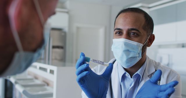 Doctor Explaining Vaccine to Patient in Clinic - Download Free Stock Images Pikwizard.com