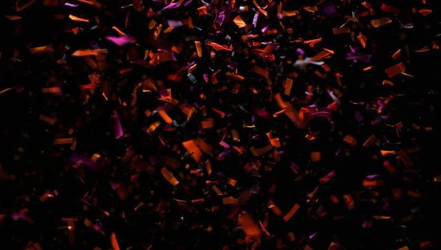 Vibrant confetti explosion on dark backdrop