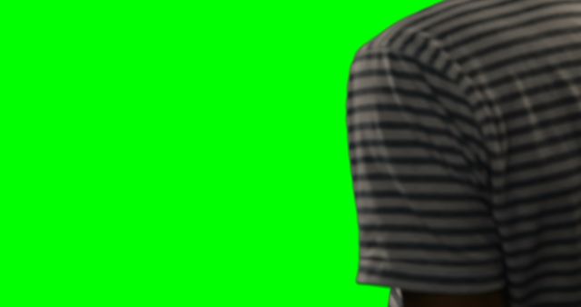 Person wearing a striped shirt is shown partially against a green screen background, perfect for video editing, content creation, or graphic design projects.
