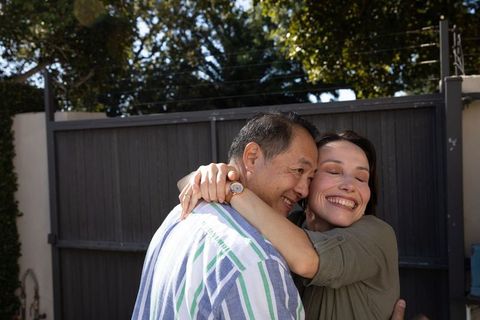 Senior Couple Embracing in Sunny Outdoor Setting