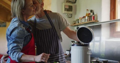 Senior Couple Composting Together in Kitchen for Eco-Friendly Living