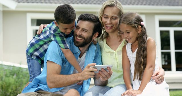 Happy Family Enjoying Time Together Outside with Tablet - Download Free Stock Images Pikwizard.com