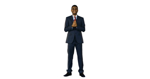 Confident professional man wearing suit and red tie is smiling while clasping hands. Ideal for business, corporate presentations, office scenarios, and executive portraits.