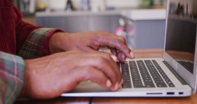 Close-up of hands typing on laptop in office setting - Download Free Stock Images Pikwizard.com