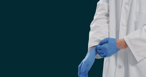 Doctor Wearing Gloves for Safety Precaution