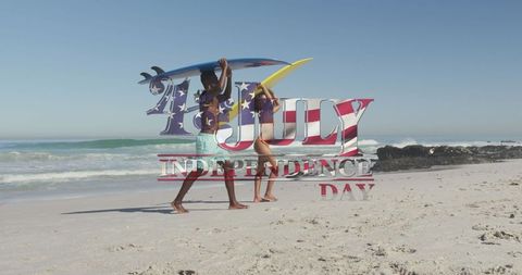 Couple Celebrating Independence Day with Surfboards on Beach - Download Free Stock Images Pikwizard.com