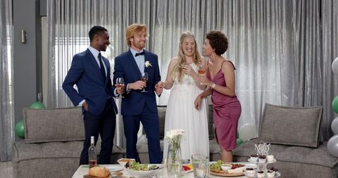 Joyful Wedding Toast with Multiracial Friends Indoors